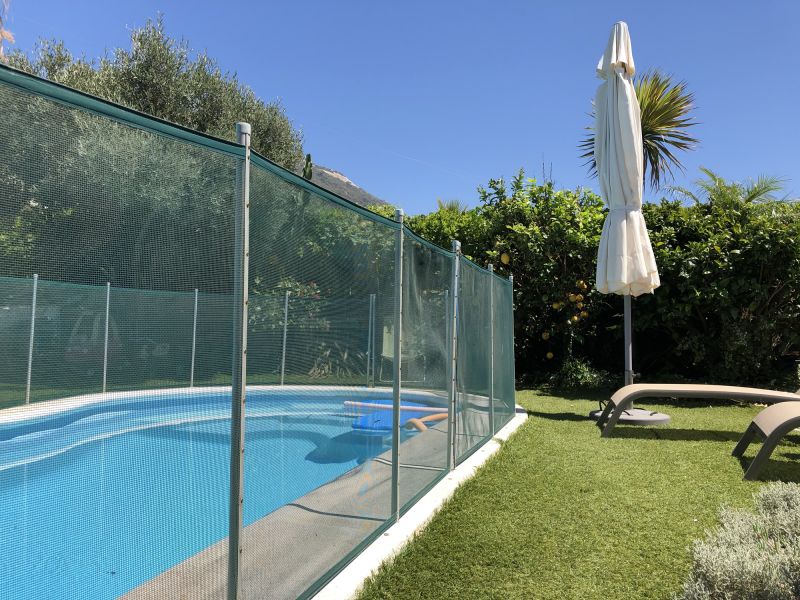 Pool with Mesh Fence Barrier